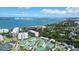 Panoramic aerial shot of the property and the surrounding beach and water at 220 Belleview Blvd # 104, Belleair, FL 33756