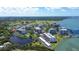 An aerial shot showing waterways and golf courses surrounding the building at 220 Belleview Blvd # 104, Belleair, FL 33756