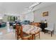 Bright dining room featuring a dining table, modern lighting, and stylish decor at 220 Belleview Blvd # 104, Belleair, FL 33756
