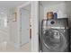 Convenient laundry area with modern appliances, located next to a hallway at 220 Belleview Blvd # 104, Belleair, FL 33756