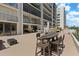 Expansive outdoor patio with dining and seating areas, ideal for relaxation and social gatherings at 220 Belleview Blvd # 104, Belleair, FL 33756