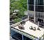 Spacious outdoor patio featuring dining table, lounge seating, and pool table for entertaining at 220 Belleview Blvd # 104, Belleair, FL 33756