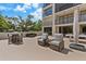 Cozy patio with comfortable seating, outdoor dining, and a fun pool table at 220 Belleview Blvd # 104, Belleair, FL 33756