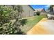 The backyard features a patio area perfect for outdoor relaxation, surrounded by lush greenery and partial fencing at 2459 Bay Berry Dr, Clearwater, FL 33763