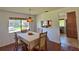 Comfortable dining area featuring wood floors, seating for four, and convenient access to kitchen at 2459 Bay Berry Dr, Clearwater, FL 33763