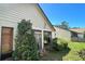 Exterior view of home with mature landscaping around the perimeter at 2459 Bay Berry Dr, Clearwater, FL 33763