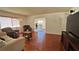 Spacious living room featuring gleaming hardwood floors, neutral walls, and a view into another living space at 2459 Bay Berry Dr, Clearwater, FL 33763