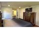 Bright main bedroom featuring a large bed and dark wooden dresser at 2459 Bay Berry Dr, Clearwater, FL 33763