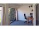 This office features a large sliding glass door with views of lush vegetation and a traditional wood desk at 2459 Bay Berry Dr, Clearwater, FL 33763