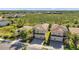 Beautiful aerial view of the home nestled within lush greenery and manicured lawns on a sunny day at 2495 Oakwood Preserve Dr, Wesley Chapel, FL 33543