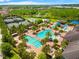 Expansive aerial view of pools and recreation facilities, perfect for Gathering fun and leisure at 2495 Oakwood Preserve Dr, Wesley Chapel, FL 33543