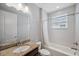 Clean bathroom with a granite vanity, shower-tub, and plenty of natural light for a bright and functional space at 2495 Oakwood Preserve Dr, Wesley Chapel, FL 33543