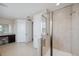 Clean and bright bathroom with glass-enclosed shower and vanity in close proximity to other facilities at 2495 Oakwood Preserve Dr, Wesley Chapel, FL 33543