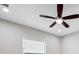 Bedroom features a ceiling fan and a window with horizontal blinds at 2495 Oakwood Preserve Dr, Wesley Chapel, FL 33543