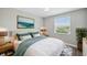 Inviting bedroom with ample natural light, stylish furnishings, and a calming color scheme for a comfortable and relaxing atmosphere at 2495 Oakwood Preserve Dr, Wesley Chapel, FL 33543