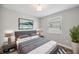 Comfortable bedroom featuring a serene color palette, soft lighting, and contemporary decor for a restful ambiance at 2495 Oakwood Preserve Dr, Wesley Chapel, FL 33543