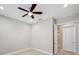 Bedroom features neutral walls, a ceiling fan, recessed lighting, and an en-suite bathroom at 2495 Oakwood Preserve Dr, Wesley Chapel, FL 33543
