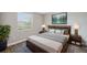 Stylish bedroom with a calming color scheme, large window, and comfortable furnishings creating a relaxing retreat at 2495 Oakwood Preserve Dr, Wesley Chapel, FL 33543