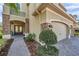 A welcoming front entrance with stone accents and covered porch at 2495 Oakwood Preserve Dr, Wesley Chapel, FL 33543