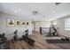 Bright, spacious home gym with weight equipment, elliptical machine, and motivational art for a healthy lifestyle at 2495 Oakwood Preserve Dr, Wesley Chapel, FL 33543