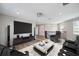 Modern living room with comfortable seating, large TV, and stylish decor for entertainment and relaxation at 2495 Oakwood Preserve Dr, Wesley Chapel, FL 33543