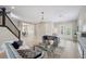 Bright and airy living room with staircase and open floor plan at 2495 Oakwood Preserve Dr, Wesley Chapel, FL 33543