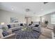 Inviting living room with modern furniture and large windows offering lots of natural light at 2495 Oakwood Preserve Dr, Wesley Chapel, FL 33543