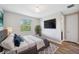 Cozy main bedroom with a large window, neutral tones, and an ensuite bathroom, providing a relaxing private retreat at 2495 Oakwood Preserve Dr, Wesley Chapel, FL 33543