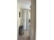 Hallway leading to kitchen, with ample storage cabinets and tile flooring at 3206 W Azeele St # 218, Tampa, FL 33609