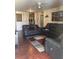 Cozy living room with hardwood floors, ceiling fan and closet, providing a comfortable living space at 3206 W Azeele St # 218, Tampa, FL 33609