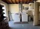 Unfinished basement with washer, dryer, and water heater installation, offering functionality and potential at 3330 Monticello St, Holiday, FL 34690