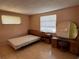Bedroom with carpet and light wood furniture including vanity and bedside tables at 3330 Monticello St, Holiday, FL 34690