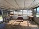 Enclosed porch features a fireplace, multiple windows and plenty of natural light at 3330 Monticello St, Holiday, FL 34690