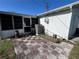 View of the back patio with access to the screen room, offering outdoor space at 3330 Monticello St, Holiday, FL 34690