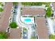 Aerial view of a well-maintained condo community featuring a refreshing pool and neatly arranged parking spaces at 4332 Har Paul Cir, Tampa, FL 33614