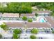 An aerial view shows organized condo buildings with ample parking and a refreshing community pool at 4332 Har Paul Cir, Tampa, FL 33614