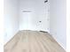 Neutral bedroom with white walls, wood-look floors, and ample closet space at 4332 Har Paul Cir, Tampa, FL 33614