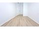 Empty bedroom features white walls, wood-look floors, and modern trim at 4332 Har Paul Cir, Tampa, FL 33614