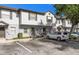 Inviting two-story townhouse featuring neutral siding, manicured landscaping, and convenient parking at 4332 Har Paul Cir, Tampa, FL 33614