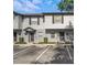 Charming two-story townhouse with neutral siding, dark shutters, and well-maintained landscaping at 4332 Har Paul Cir, Tampa, FL 33614