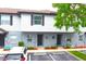 Charming townhomes featuring well-manicured landscaping, designated parking, and neutral exterior colors at 4332 Har Paul Cir, Tampa, FL 33614