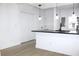 Bright kitchen features modern lighting, white cabinets, and black countertops at 4332 Har Paul Cir, Tampa, FL 33614