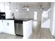 Open-concept kitchen with stainless steel dishwasher, adjacent to stairs, for a modern, integrated living space at 4332 Har Paul Cir, Tampa, FL 33614