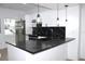 Bright kitchen with a stylish island, stainless steel appliances, and modern pendant lighting for an inviting atmosphere at 4332 Har Paul Cir, Tampa, FL 33614