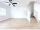 Spacious living room features white walls, ceiling fan, and light floors at 4332 Har Paul Cir, Tampa, FL 33614