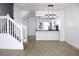 Open-concept living area boasts white walls, light floors, and staircase at 4332 Har Paul Cir, Tampa, FL 33614