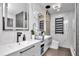 Bright bathroom featuring double vanity, marble wall, floating vanity, with modern black and copper fixtures at 449 S 12Th St # 504, Tampa, FL 33602