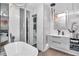 Luxurious bathroom features marble walls, a modern tub, and a sleek vanity with designer fixtures at 449 S 12Th St # 504, Tampa, FL 33602