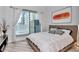 Bright bedroom with balcony access and natural light, showcasing modern design and comfortable living at 449 S 12Th St # 504, Tampa, FL 33602