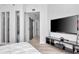Modern bedroom with a sliding barn door, sleek furnishings, and light wood flooring at 449 S 12Th St # 504, Tampa, FL 33602